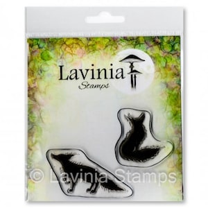 May include: Clear packaging with two black silhouette stamps of foxes. The packaging has a green and brown watercolor background with the text "Lavinia Stamps" in black.