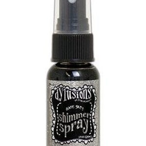 May include: A small bottle of black shimmer spray with a silver label that reads "d'vine shimmer spray".