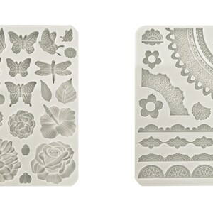 May include: Two silicone molds for baking. The first mold features a variety of floral and butterfly designs. The second mold features a variety of lace designs.