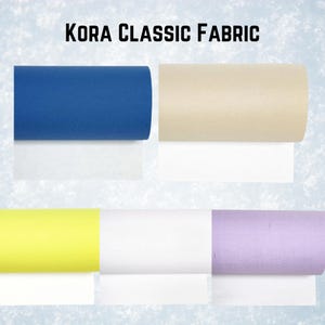 May include: Five rolls of KORA CLASSIC FABRIC in different colors: blue, beige, yellow, white, and lavender.