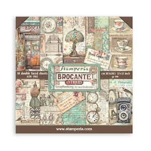 May include: A square paper pad with a collage of vintage-themed images. The pad features a variety of designs, including teacups, clocks, and antique shop scenes. The text "BROCANTE ANTIQUES" is prominently displayed, along with the dimensions 12x12 inches.