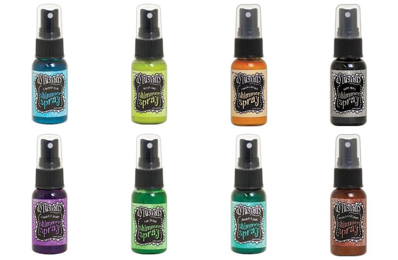 May include: Eight bottles of Dylusions Shimmer Spray in various colours, including teal, green, orange, black, purple, lime green, turquoise, and copper.