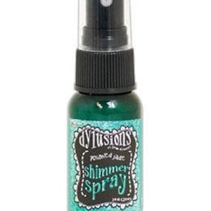 May include: A small bottle of turquoise shimmer spray with a black spray nozzle and a white label that says "dylusions" in a black script font and "shimmer spray" in a white script font.