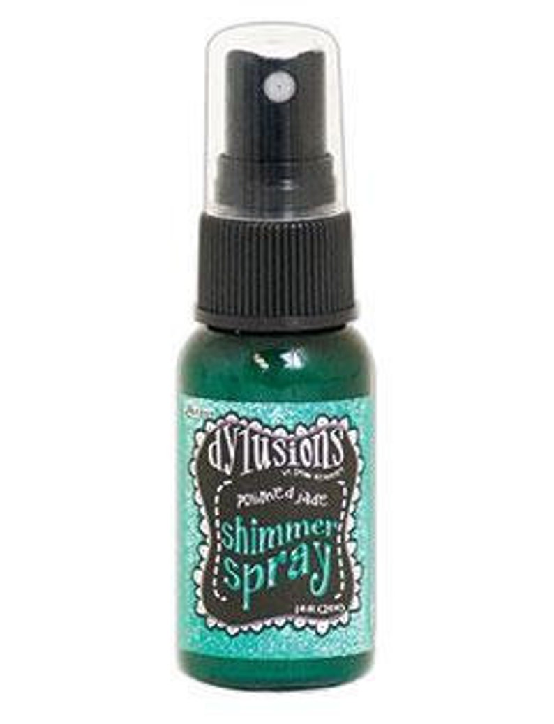 May include: A small bottle of turquoise shimmer spray with a black spray nozzle and a white label that says "dylusions" in a black script font and "shimmer spray" in a white script font.