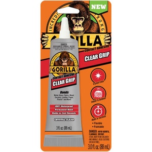 May include: A 3 fl oz (88 ml) tube of Gorilla Contact Adhesive Clear Grip. The tube is silver with black text and a gorilla logo. The packaging is orange and black with the text "New" and "Incredibly Strong".
