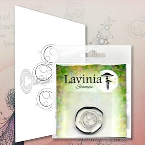 May include: A clear rubber stamp with a design of overlapping circles. The stamp is packaged in a clear plastic sleeve with a white label that reads "Lavinia Stamps".
