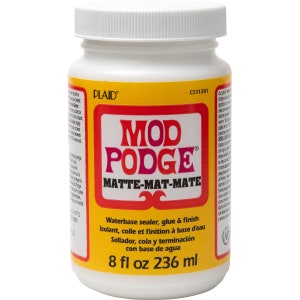 May include: A white plastic bottle of Mod Podge Matte-Mat-Mate, a water-based sealer, glue, and finish. The label is yellow with a red rectangle containing the product name. The bottle contains 8 fl oz, equivalent to 236 ml.