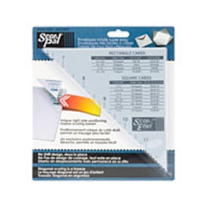 May include: A clear plastic ruler with a blue border and the text "Scor-Pal" printed on it. The ruler has markings for different sizes of cards, including rectangular and square cards. The ruler is designed to help crafters accurately cut and score cardstock.