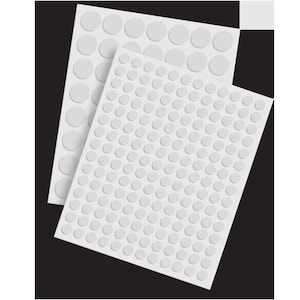 May include: Three sheets of white adhesive-backed round dots. The dots are arranged in a grid pattern.
