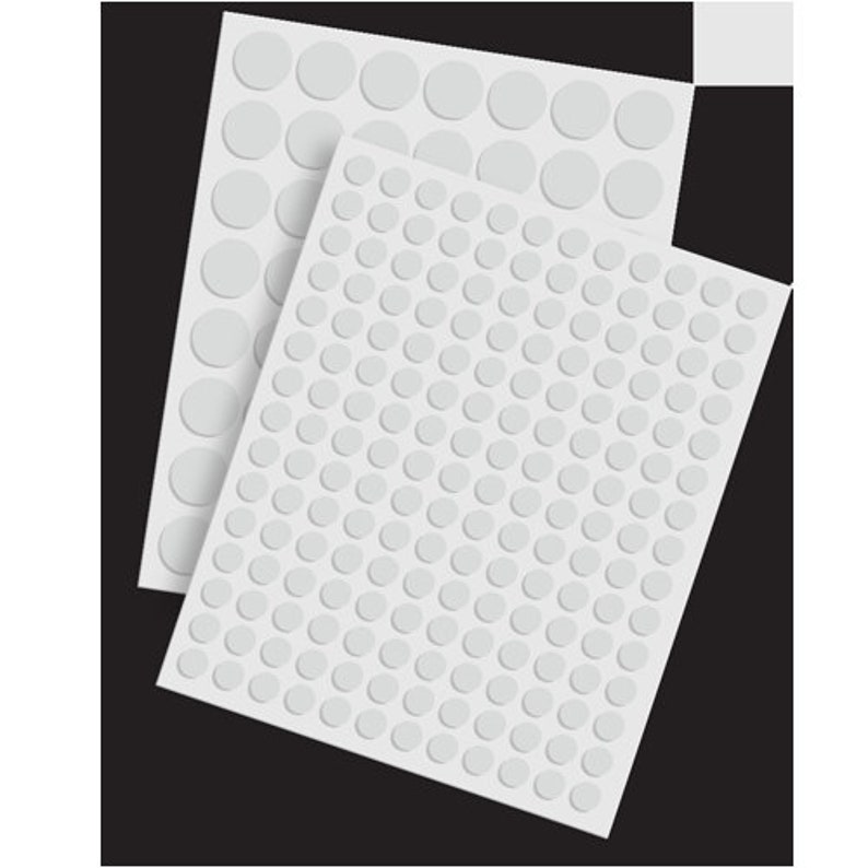 May include: Three sheets of white adhesive-backed round dots. The dots are arranged in a grid pattern.