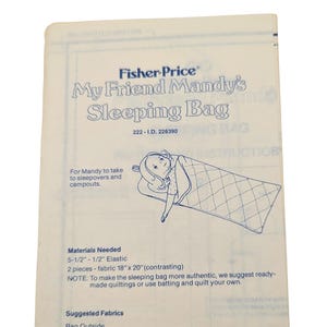 May include: A vintage Fisher-Price instruction sheet for "My Friend Mandy's Sleeping Bag." The illustration shows a child in a sleeping bag. The sheet lists materials needed, including 5-1/2" - 1/2" elastic and fabric pieces 18" x 20".