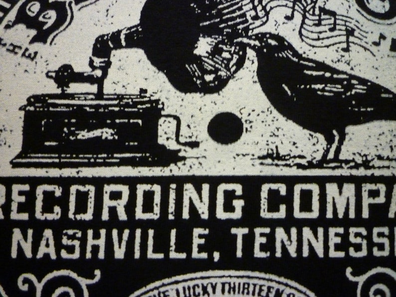 May include: Black and white image of a vintage record player with a crow perched on top. The text "RECORDING COMPANY NASHVILLE, TENNESSEE" is printed below the image.