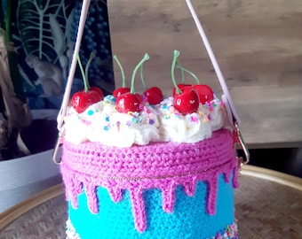 Handmade crochet cake handbag purse. Cherry sprinkles