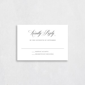 May include: A white RSVP card with black text. The text reads "Kindly Reply by the Fifteenth of September." There are two lines below the text, one that says "Happily Accepts" and one that says "Regretfully Declines."