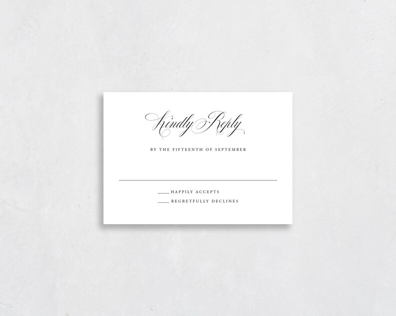 May include: A white RSVP card with black text. The text reads "Kindly Reply by the Fifteenth of September." There are two lines below the text, one that says "Happily Accepts" and one that says "Regretfully Declines."