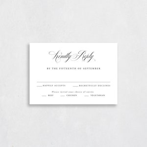 May include: A white RSVP card with black text. The text reads "Kindly Reply by the Fifteenth of September."  The card has two options: "Happily Accepts" and "Regretfully Declines."  Below the options is a list of entrees: "Beef", "Chicken", and "Vegetarian".