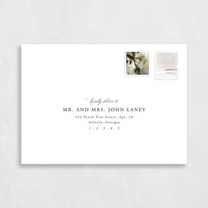 May include: A white envelope with a handwritten address for Mr. and Mrs. John Laney. The address includes a street address, apartment number, city, state, and zip code. The envelope has two postage stamps, one with a floral design and the other with a seascape.