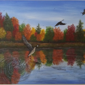 Beautiful fall forest back ground painting with red, orange, yellow and green trees. Geese flying off a beautiful pond. Hand painted.