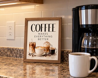 May include: A rectangular wooden frame containing a print with the text COFFEE MAKES EVERYTHING BETTER. The print features illustrations of four different coffee drinks, including iced coffee, a latte, a cappuccino, and black coffee.