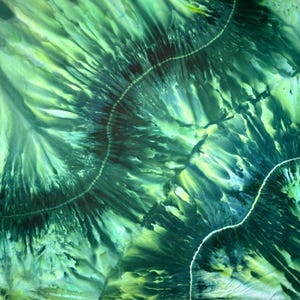 May include: Abstract art piece with a blend of green hues, from deep teal to vibrant lime. The artwork features a flowing, organic design with a textured appearance, and a white, dotted line that curves across the image. The overall effect is reminiscent of a natural landscape.