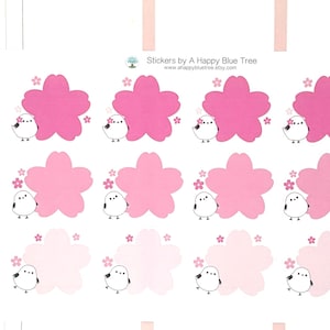 May include: A planner page with stickers featuring pink cherry blossoms and small white birds. The stickers are arranged in rows and columns. The text "Stickers by A Happy Blue Tree" is visible.