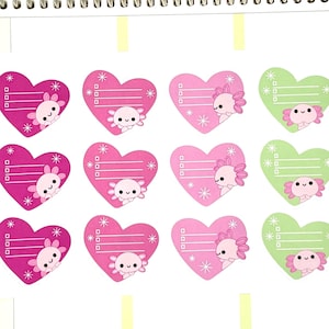 May include: A sheet of planner stickers featuring heart-shaped designs with axolotl illustrations. The stickers are in shades of pink and green, with space for notes and decorative snowflakes. The text "Stickers by A Happy Blue Tree" is visible.