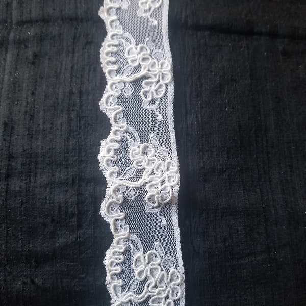 Hard to find ivory alencon lace slightly scalloped on one edge, straight on the other trim. (#100)