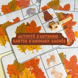 Può includere: Un set di carte stampate con foglie autunnali e vari animali, tra cui un procione, un orso, un gufo, un alce e un coniglio. Una molletta di legno poggia su una carta. Il testo recita ACTIVITÉ D'AUTOMNE : CARTES D'ANIMAUX CACHÉS.