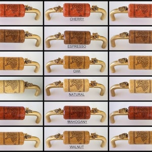 May include: Sixteen cabinet knobs with a cork base and a grapevine design. The knobs are available in six different wood finishes: cherry, espresso, oak, natural, mahogany, and walnut.