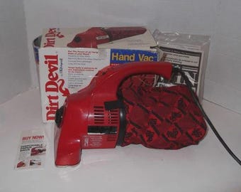 Aspiradora manual Vintage Red Dirt Devil modelo DD120 FUNCIONA con caja usada limpia