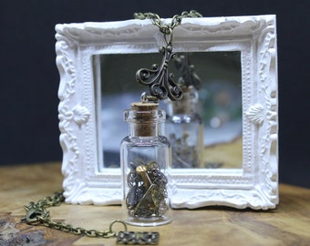Steampunk Up-cycle Watch Part Pendant Necklace. Vintage recycled wrist watch workings suspended in Miniature Glass Vial.