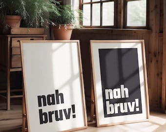 May include: Two rectangular framed wall art prints with light wooden frames. The left print features black text reading "nah bruv!" on a white background. The right print features white text reading "nah bruv!" on a solid black background.