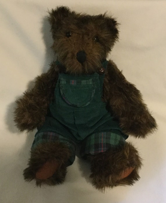 teddy bear with green overalls