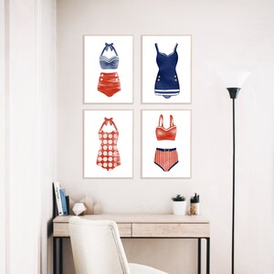 May include: Four framed prints of vintage swimsuit designs. Each print features a different red and blue swimsuit style. The swimsuits are all in a retro style.