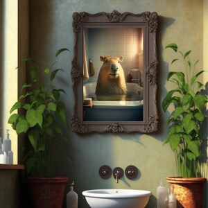 May include: A framed picture of a capybara taking a bath in a white bathtub. The picture is hanging on a wall in a bathroom with a white sink and green plants.