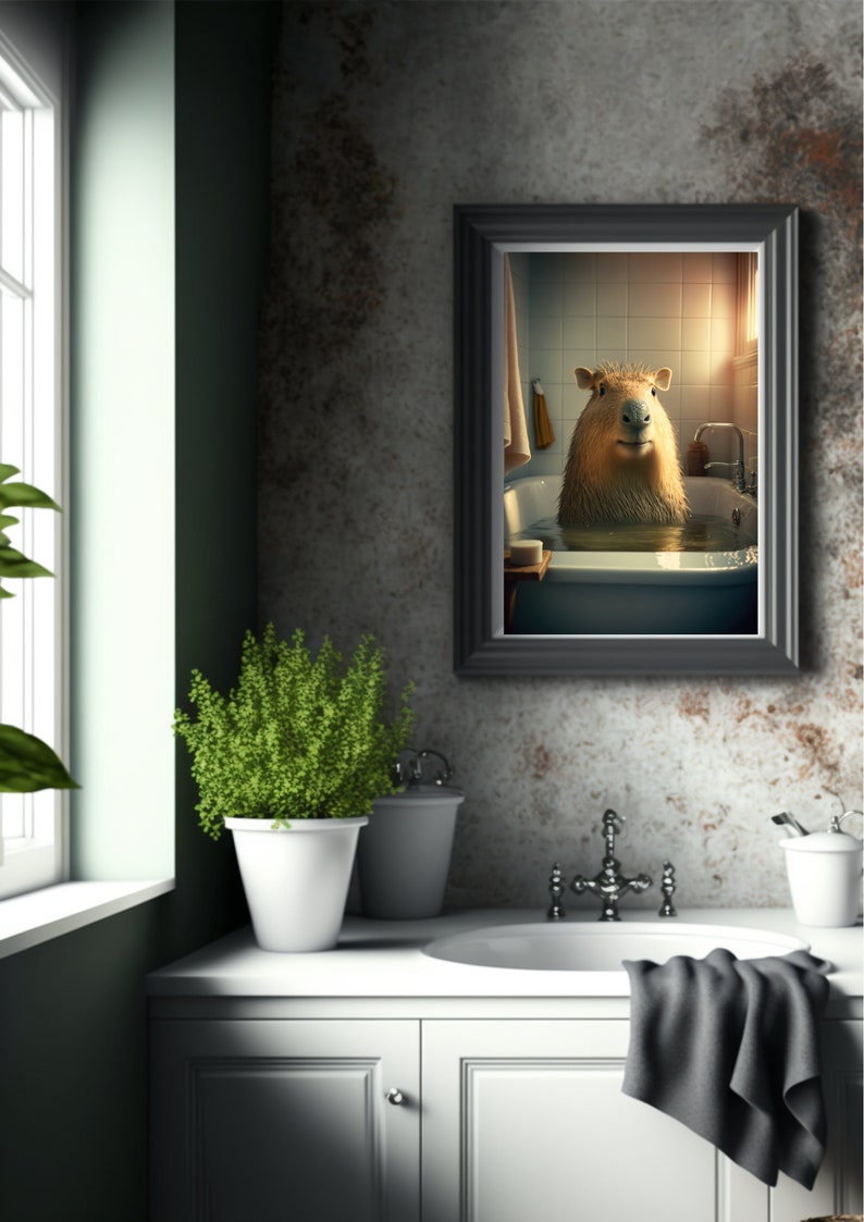 May include: A framed print of a capybara taking a bath in a white bathtub. The capybara is looking directly at the camera. The bathroom is tiled in white and has a window with sunlight streaming in.
