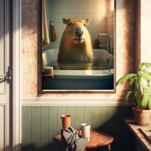 May include: A framed picture of a capybara taking a bath in a white bathtub. The capybara is looking directly at the camera. The picture is hanging on a wall in a bathroom with a wooden floor and a green tiled wall.