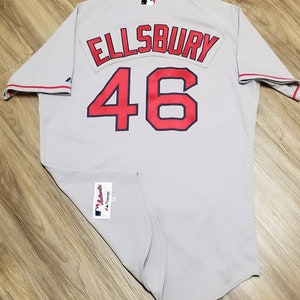 May include: A gray baseball jersey with red and blue lettering. The name "ELLSBURY" and the number "46" are on the back of the jersey.