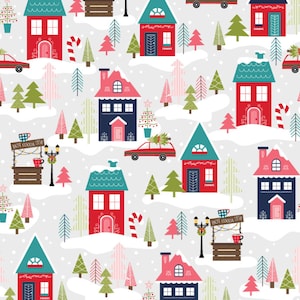 May include: A repeating pattern featuring colorful houses, Christmas trees, and red cars on a snowy landscape. The houses have red, blue, and teal roofs. A hot cocoa stand with the text "HOT COCOA 25¢" is also present.