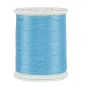 May include: A spool of light blue thread, ideal for sewing and crafting projects. The thread is tightly wound on a white plastic spool, providing a clean and organized appearance. The thread's color is a soft, pastel blue, suitable for various fabric types.