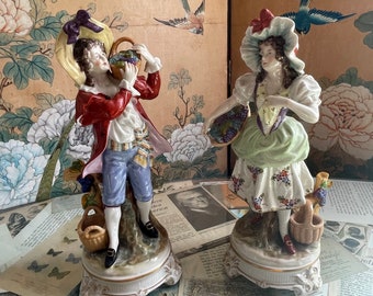 Pair of 1890's German Dresden Potschappel Carl Thieme Porcelain Large 10" Figurine Couple Holding Baskets of Grapes Vineyard Gold Gilded