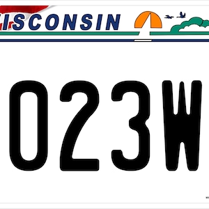 May include: A white Wisconsin license plate with the number 2023WF. The plate has a blue and green border with a small American flag in the top left corner and a small image of a tent, birds, and a red barn in the top right corner.