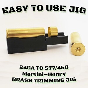 May include: A black Martini-Henry brass trimming jig with brass components. The jig is designed for 24GA to 577/450 brass trimming. The text "EASY TO USE JIG" and "BRASS TRIMMING JIG" are visible.