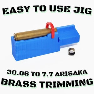 May include: A blue jig with a red clip holds a brass cartridge. The text "EASY TO USE JIG" and "30.06 TO 7.7 ARISAKA BRASS TRIMMING" are printed on the image. A small metal ring is also present.