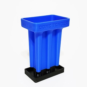 May include: A blue plastic cone tender with the text "CONE TENDER" and "SIZE 1 1/4" embossed on the top. The tender has four vertical compartments and sits on a black rectangular base. The product is designed to hold cones.