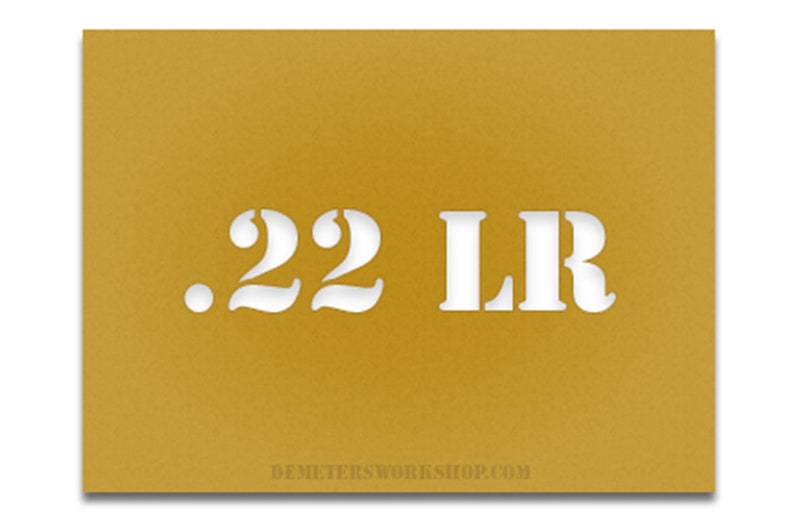 May include: Mustard-colored card with the white text ".22 LR" cut out. The website address DEMETERSWORKSHOP.COM is printed in white at the bottom of the card.