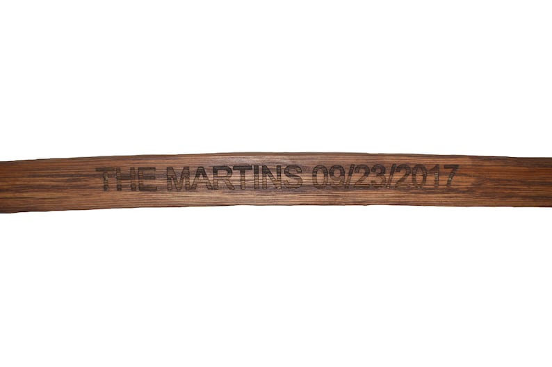 May include: A wooden sign with the text "THE MARTINS 09/23/2017" engraved on it.