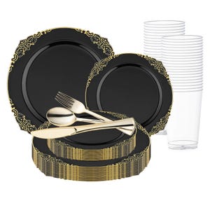May include: A set of black and gold plastic dinnerware with a decorative gold rim. The set includes plates, cups, forks, knives, and spoons.