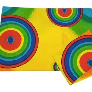 May include: A set of two yellow, green, blue, and red patterned pillowcases with concentric circles.