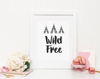 May include: A white framed print with black and white illustrations of teepees and the text "Wild & Free".
